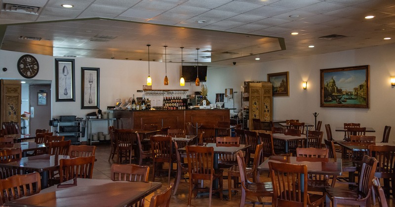 Dining tables and chairs, and a bar