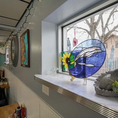 Stained glass decoration by the window.