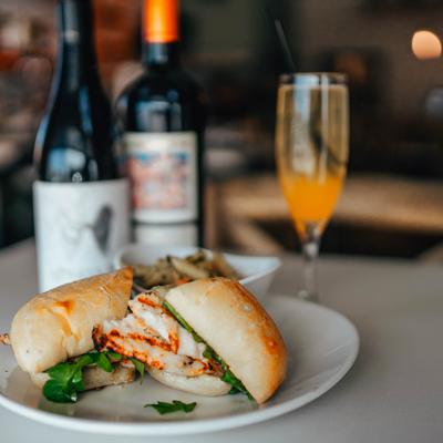 Grilled chicken panini, with provolone, prosciutto, arugula, and garlic pesto aioli.