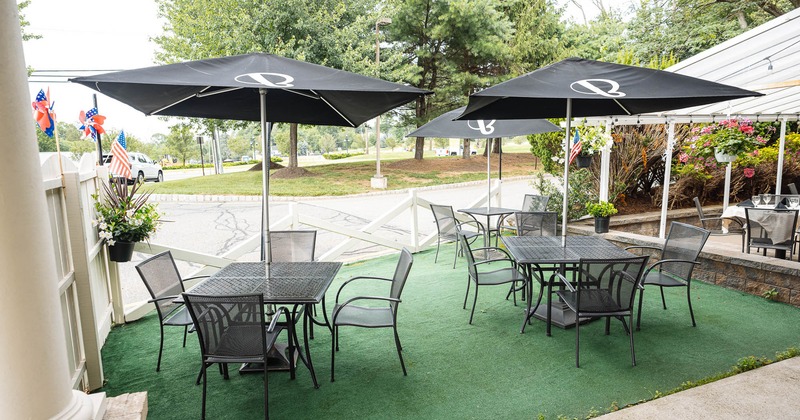 Exterior, tables, chairs and parasols on patio