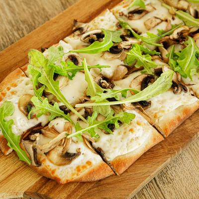 Mushroom Truffle Flatbread, with arugula.