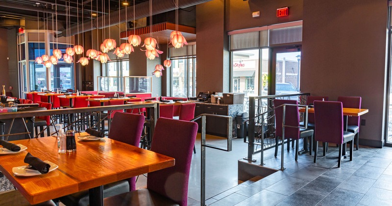 Interior, dining area with lotus lamps hanging from ceiling