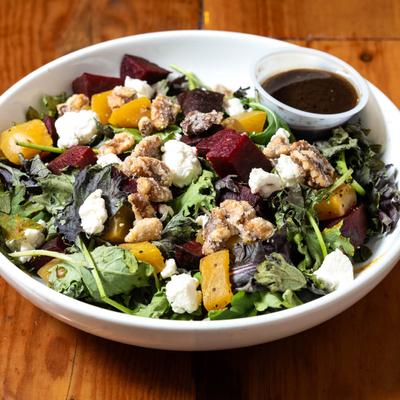 Beet and Kale salad, with goat cheese, candied walnuts, and maple vinaigrette.