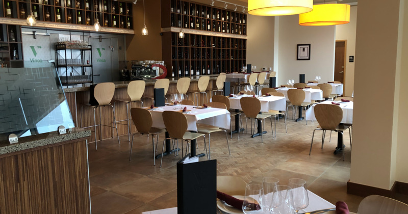 Interior space, cozy dining area with set tables