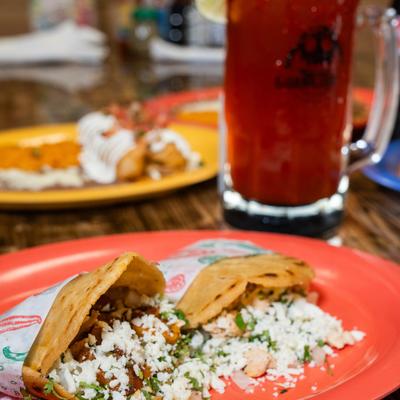 Thick corn tortillas filled with beans, onions, cilantro, and cheese.