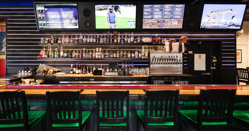 Bar with TV's and drink rack