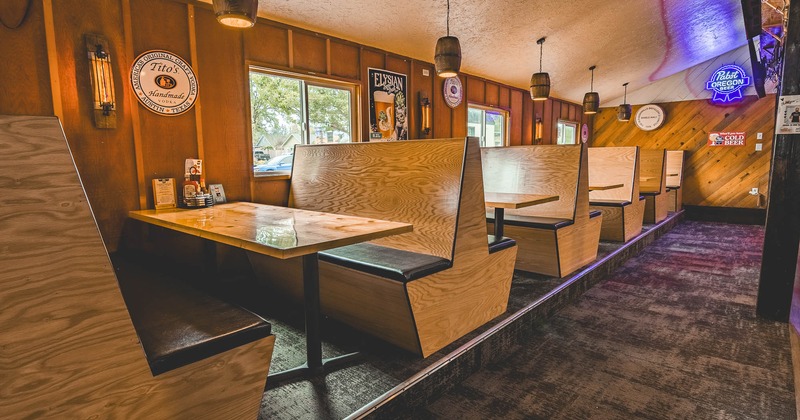 Interior, dining area with restaurant booths near window