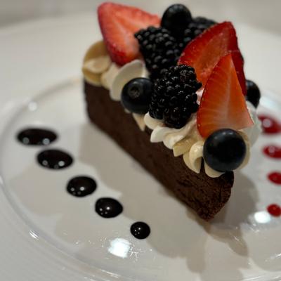 Flourless chocolate cake with fresh seasonal berries.