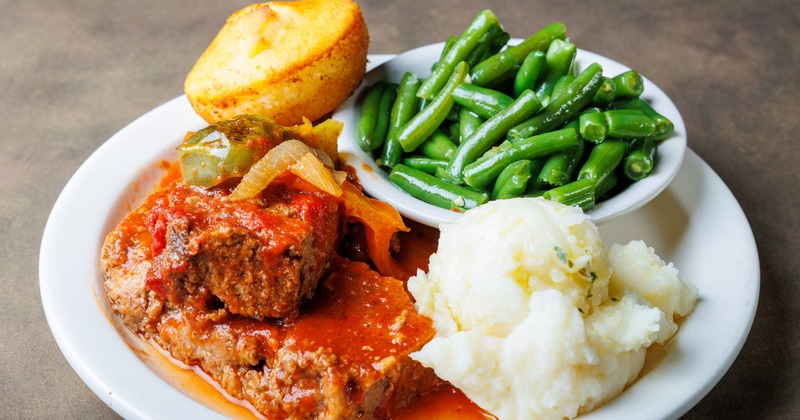 Meatloaf, with mashed potatoes, green beans, and cornbread