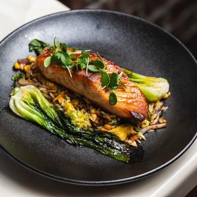 Cajun honey butter glazed salmon, broccolini, and fried rice.