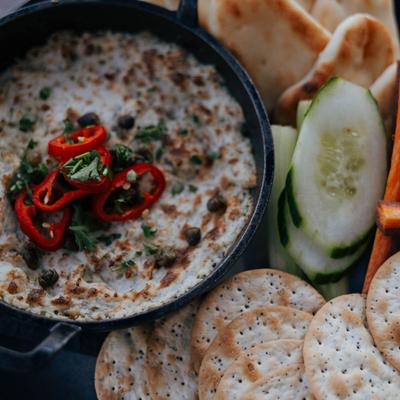 White fish dip, served with crackers, pita, sliced cucumber and carrots.