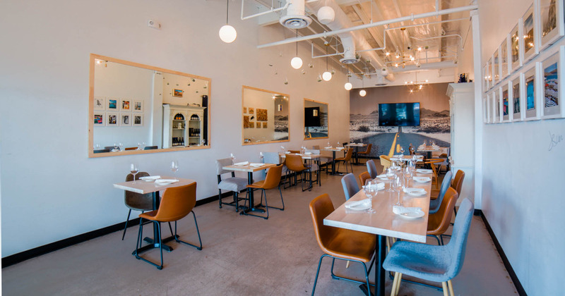 Restaurant interior, cozy dining area with set tables