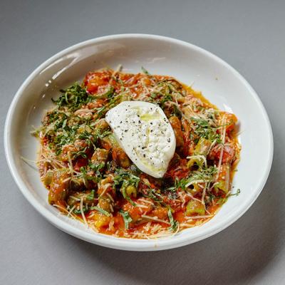Rigatoni pasta, served, front view.
