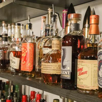 Spirit bottles on a bar shelf.