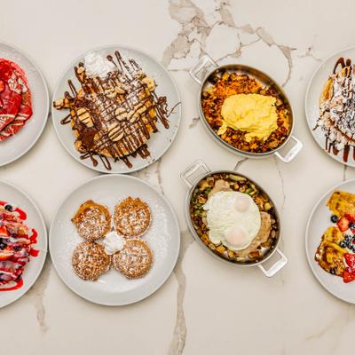 Variety of breakfast menu items served on the table.