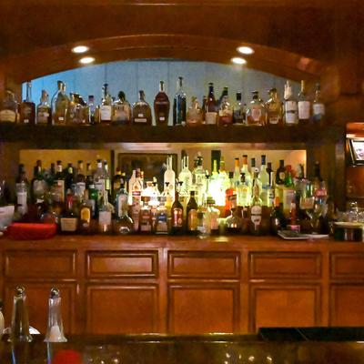 Various liquor bottles on the shelf.