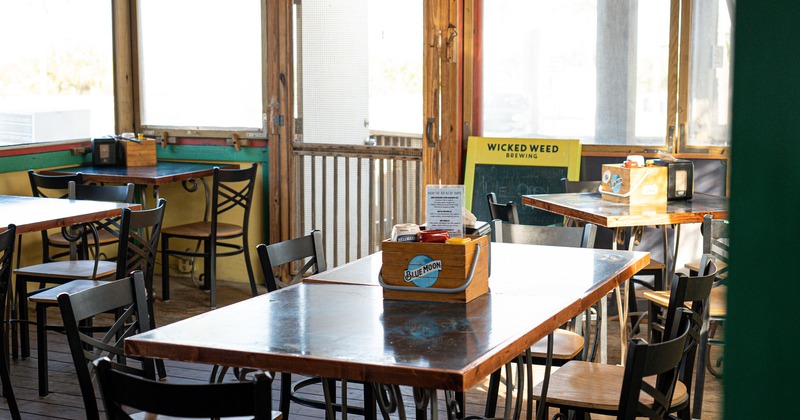 Interior, tables, chairs, windows, a door