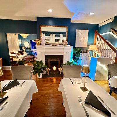 Inside, seating area, tables ready for guests.
