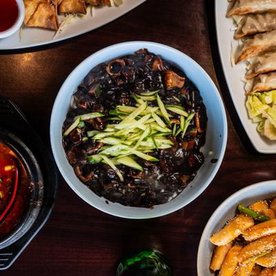 Seafood noodles and other food on the table.