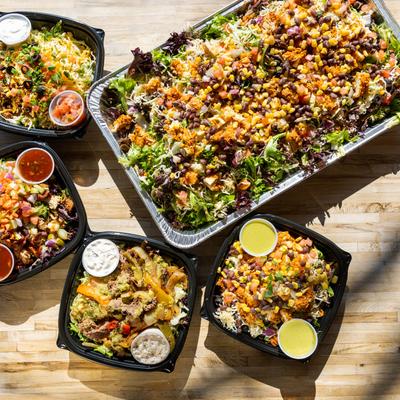 An assortment of catering salads, overhead view.