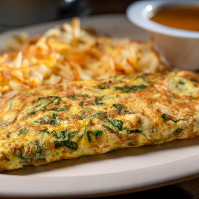 Spinach omelet plate, close up.