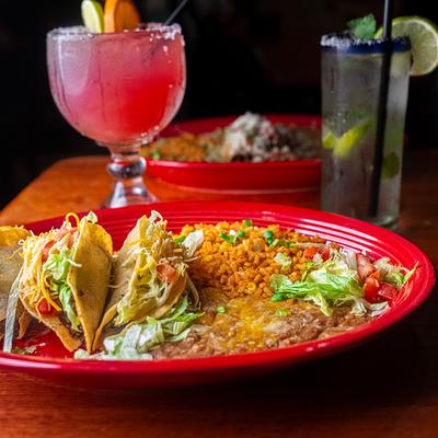 Deep Fried Tacos plate with cocktails.