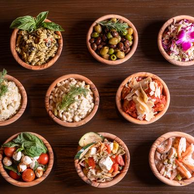All Deli side dishes arranged on a table, top view.