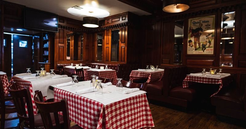 Set dining tables, with patterned table cloths and table items