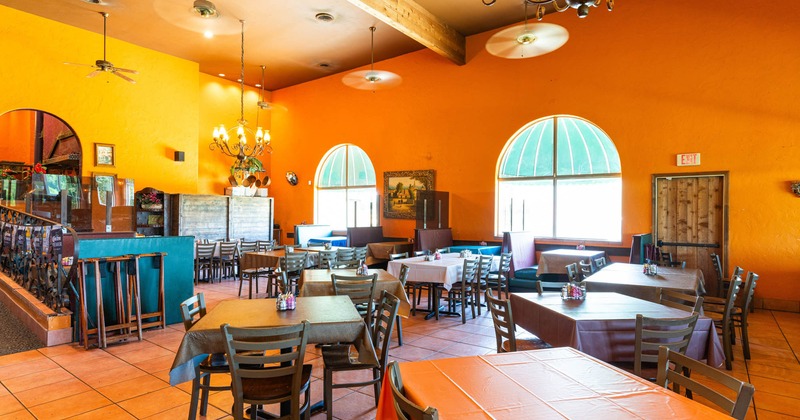 Interior, dining area, tables and chairs ready for guests