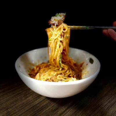 A bowl of noodle dish.