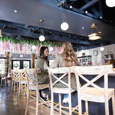 Customers sitting at the bar.