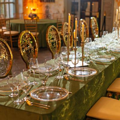 Close view of place settings with gold accents.