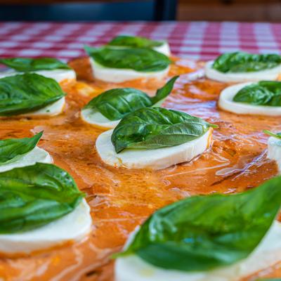 Grandma pizza, with vodka sauce, mozzarella, and basil.
