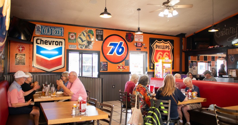 Interior, diner area, tables, chairs, people