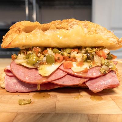 Sandwich with ham, cheese, and relish.