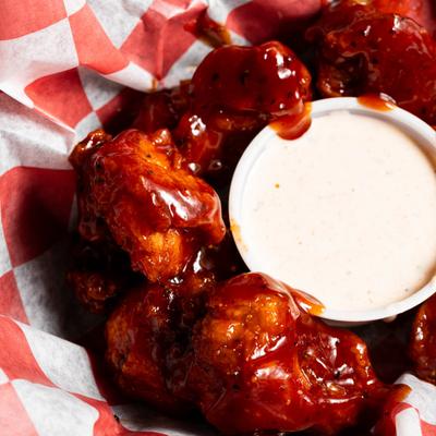 Boneless BBQ chicken wings and dip.