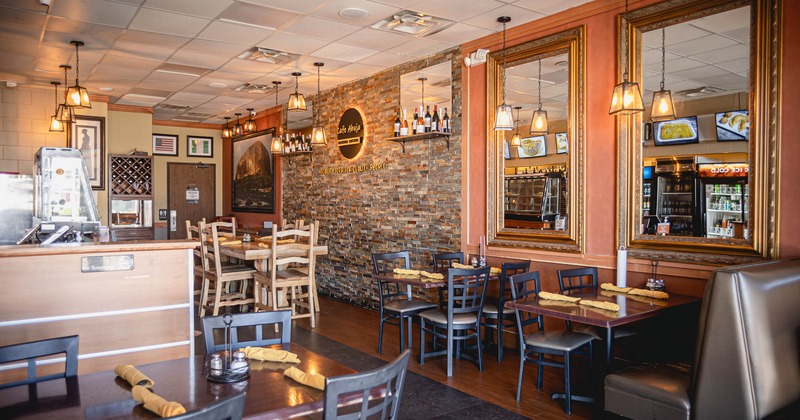 Interior, dining area with mirrors on the wall