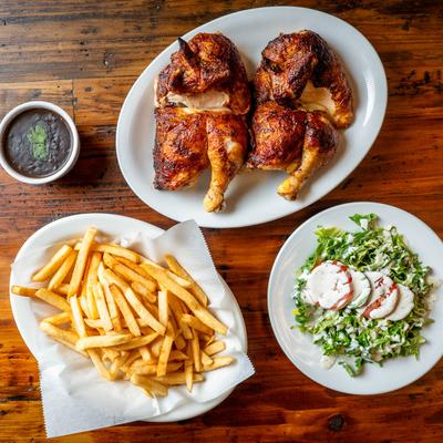 Roasted chicken, fries, and a salad.
