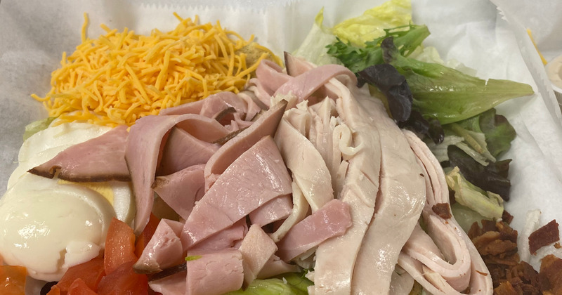 Smoked meat, mixed vegetables and dip on the side