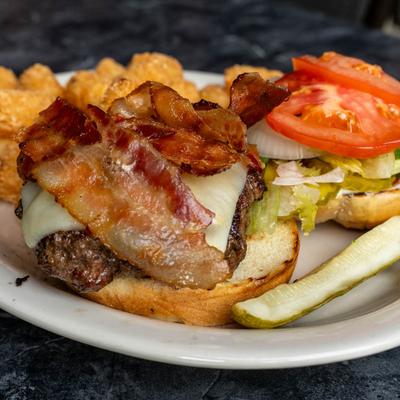 Burger with bacon and cheese, served with tater tots.