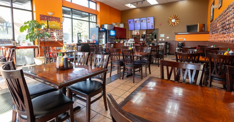 Interior dining area with wooden chairs and tables
