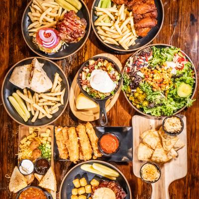Miscellany of dishes displayed on a table side by side, flat view.