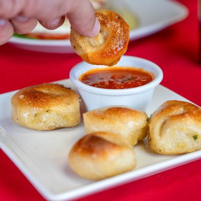 Garlic knots, with marinara sauce.