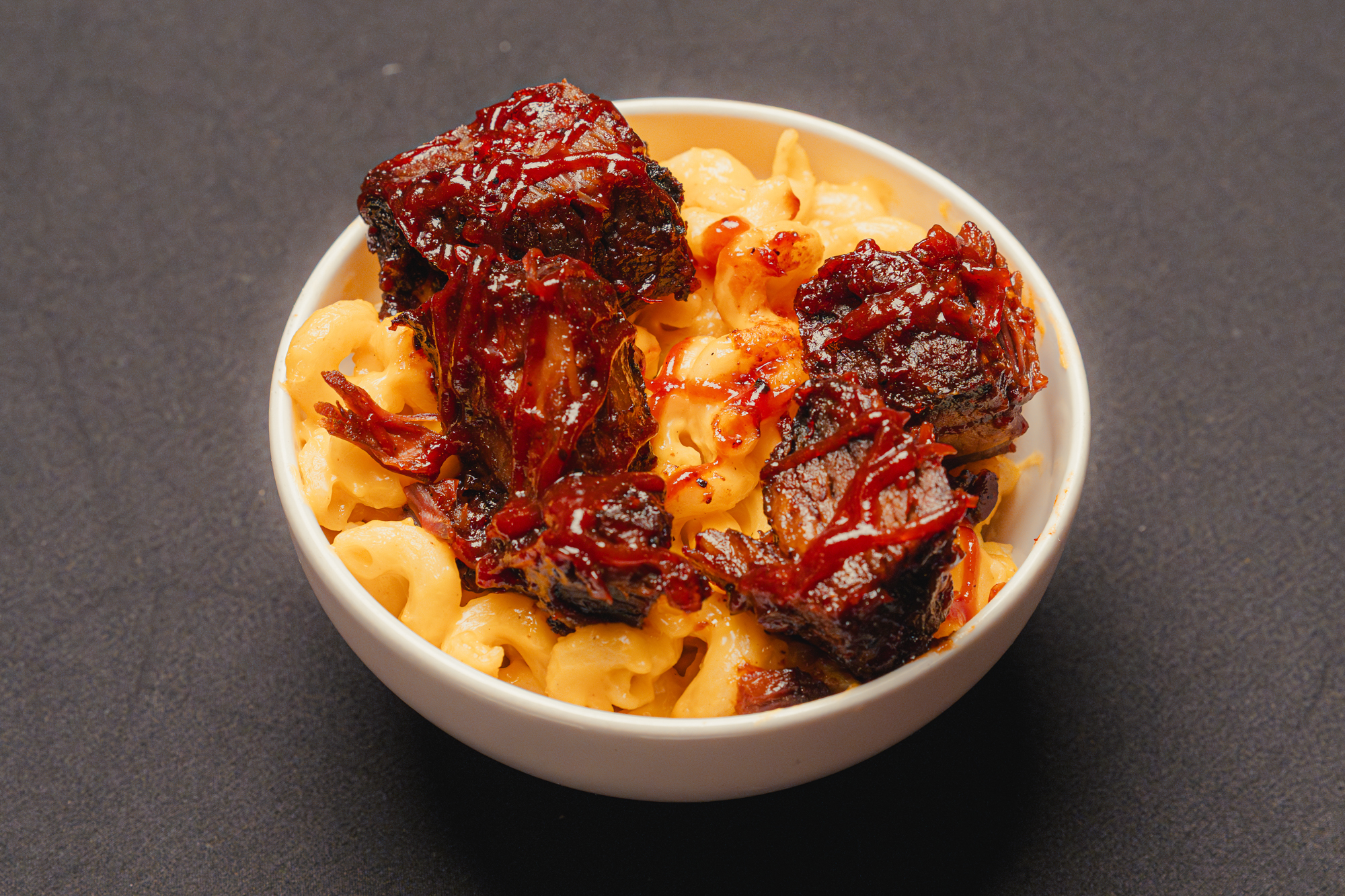 Mac n’ cheese topped with brisket burnt ends