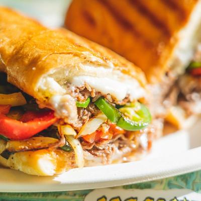 Close-up of a Philly cheesesteak sandwich.