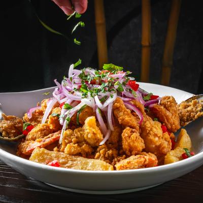 Mixed deep fried seafood with Peruvian salsa and yuca fries.