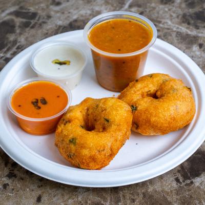 Deep fried snack made from black lentils, served with chutneys and a lentil based gravy.