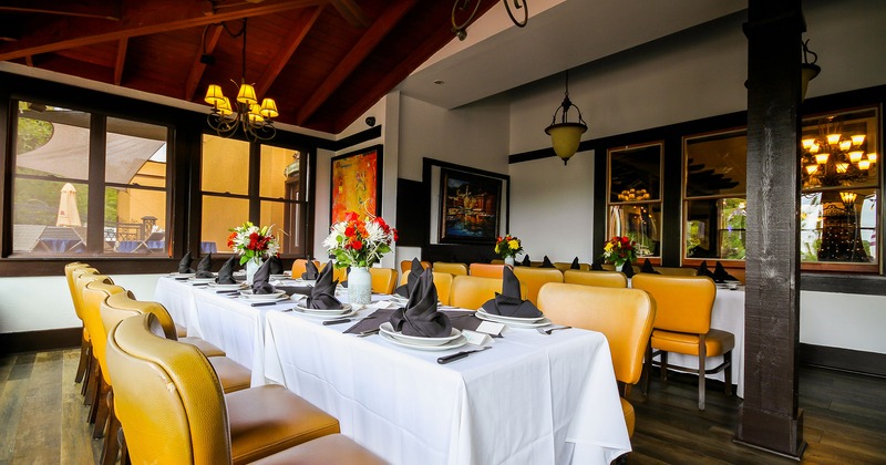 Restaurant interior, dining table set for ten guests