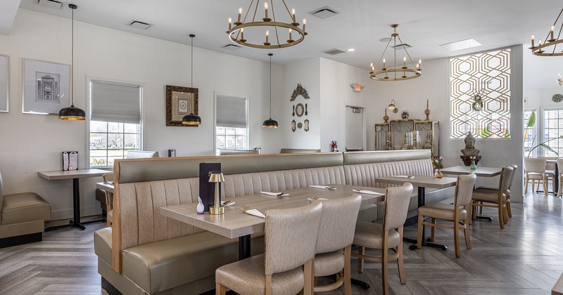 Cozy interior main dining area with set tables ready for guests