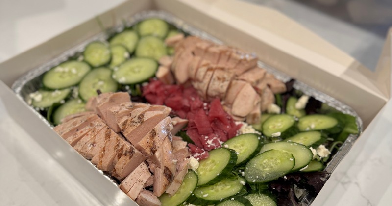 Sandwich board on store counter